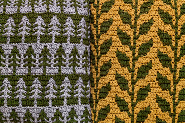 istock Mosaic crochet fabric with foliage and Christmas tree pattern. 1763410681