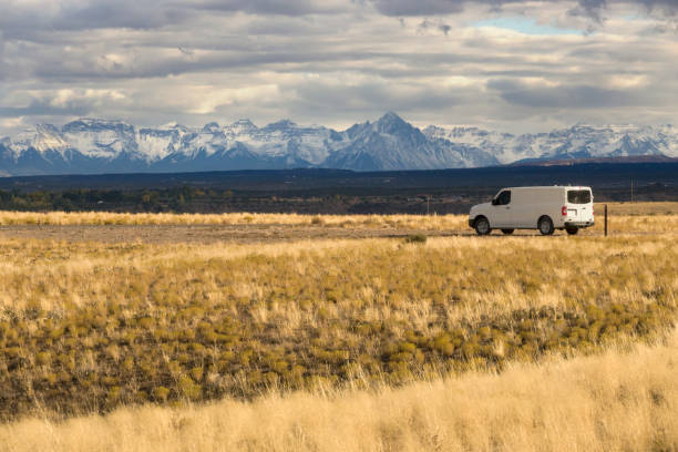 Van in grasslands Mount Sneffels Range Montrose Colorado