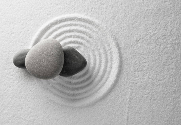 istock Zen Garden with Grey stone on White Sand Circles Pattern in Japanese stye, Harmony,Meditation,Feng Shui ,Zen like concept 1763420203