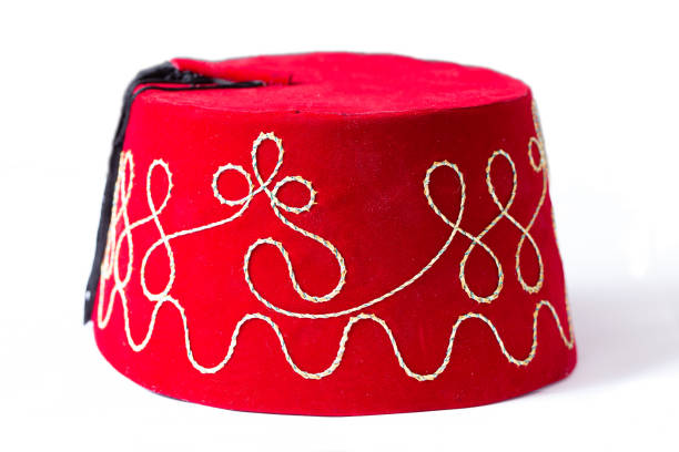 Red fez hat or tarbush hat with festive decoration isolated on the white background