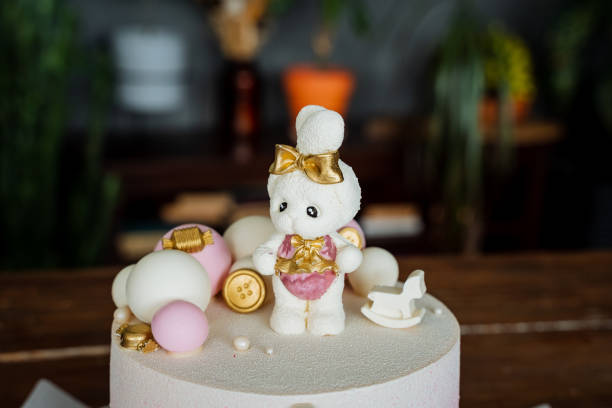 istock A white chocolate hare decorates a children's birthday cake, a delicious bright cake, a composition of cakes, glaze covers the cake. 1763480919