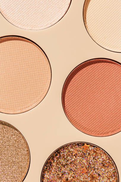 istock Close up minimal pattern with colorful eye shadow samples, trend color swatches on beige background. Eyeshadows powder with glitters for makeup, shiny and matte, aesthetic photo, top view 1763481294