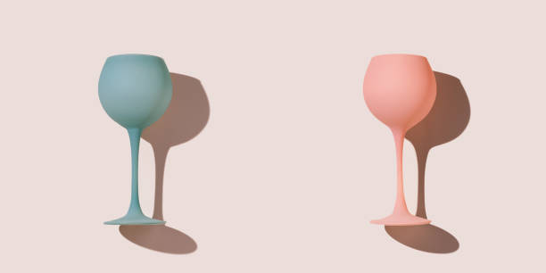 istock Minimal composition from two pink blue colored wine glasses on pastel pink background, stylish layout of goblets, stemmed glass. Entertainment, event, party concept. Abstract alcohol drinks 1763481485