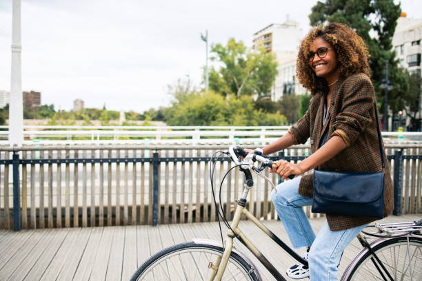 istock Happy Latin woman cycling through Valencia 1763482649