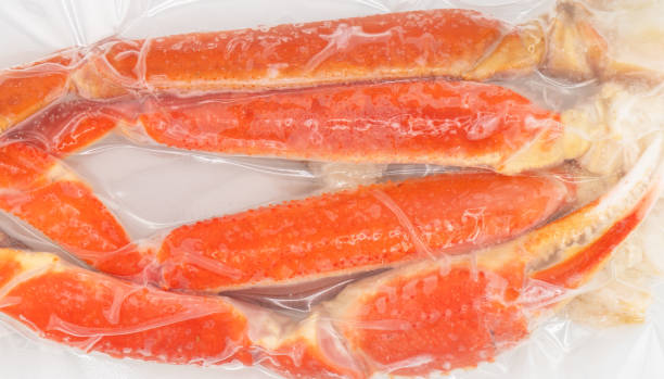 istock Vacuum packaged Peruvian Southern King crab leg texture background. Crab claws in vacuum package background 1763504771