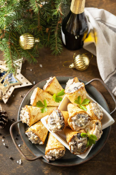 istock Creative appetizers christmas. Lavash roll cone with chicken and mushroom salad on a plate. 1763505919