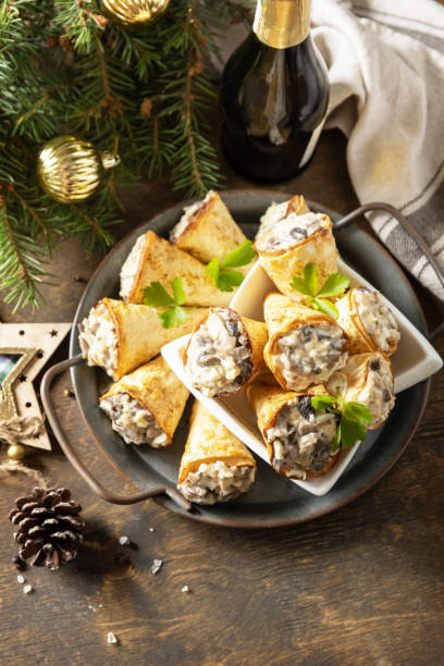 istock Creative appetizers christmas. Lavash roll cone with chicken and mushroom salad on a plate. Copy space. 1763505924