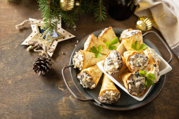 istock Creative appetizers christmas. Lavash roll cone with chicken and mushroom salad on a plate. Copy space. 1763505926