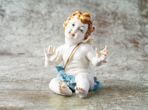 Close-up of child angel statuette Object on a White Background