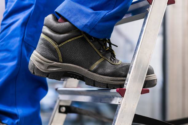 istock Handyman Climbing Ladder 1763521744