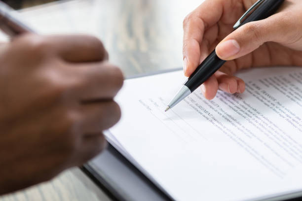 istock Businessman Signing Contract With Keys On It 1763521752