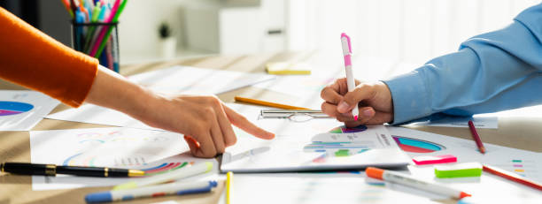 istock Startup company employee working together analyzing BI dashboard paper. Synergic 1763543711