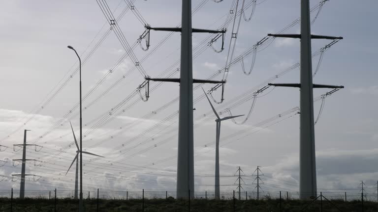 Electricity pylons, cables and windmills