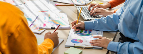 istock Startup company employee working together analyzing BI dashboard paper. Synergic 1763561199