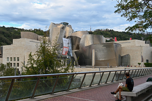 Bilbao, Spain, October 18, 2023 - Bilbao Guggenheim Museum seen from Avenida Abandoibarra, Spain.