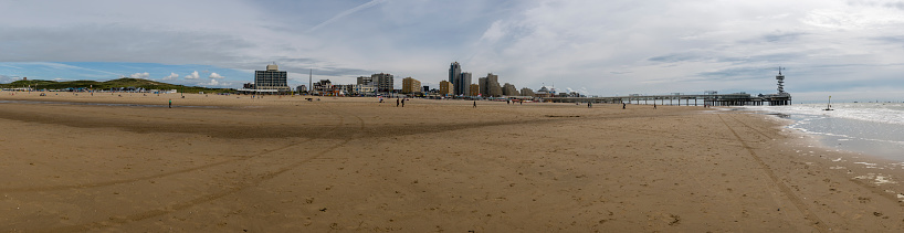 Scheveningen Strand, The Hague, Netherlands. 20/06/2015.  Hundreds of people enjoy the clean sands of the Blue Flag awarded Scheveningen Strand on a very hot summer day.  Scheveningen Strand is probably the Netherland's favourite and most famous beach, stretching to around 4.5km long, and an average of 110m wide, and is part of the coastline with the North Sea.  The famous pier is 300m long, and has a 60 metre tall tower at the end offering panoramic views of the area.  Entrance to the pier is free of charge.