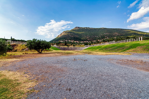 Ancient Greek Stadium in Ancient Messini in Greece. Ancient Messini was founded in 371 BC after the Theban general Epaminondas defeated Sparta at the Battle of Leuctra, freeing the Messinians from almost 350 years of Spartan rule.