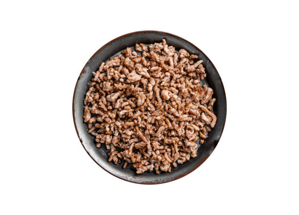 istock Fried mince beef and lamb meat in a tray with spices.   Isolated on white background. 1763624711