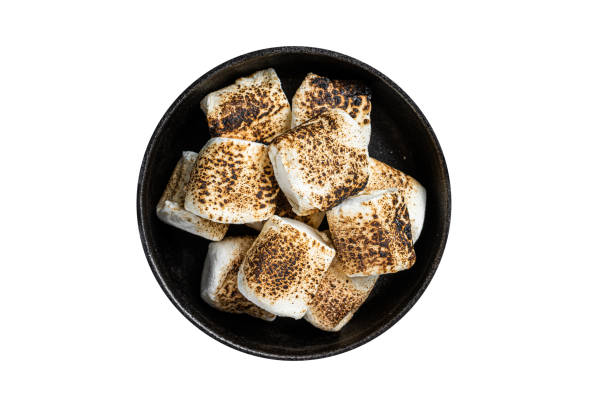 istock Toasted Marshmallow on open campfire in a skillet.  Isolated on white background. 1763625901