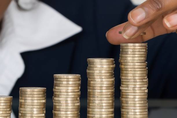 istock Businesswoman Making Stack Of Coins 1763626530