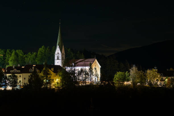 Catholic church in the village of Terenten in South-Tyrol, Italy is illuminated at night.