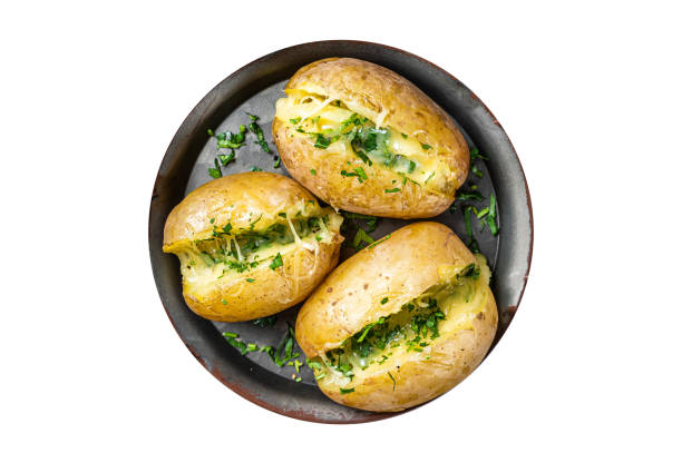 istock Baked Jacket potatoes with cheese, herbs and butter.  Isolated on white background. 1763646429