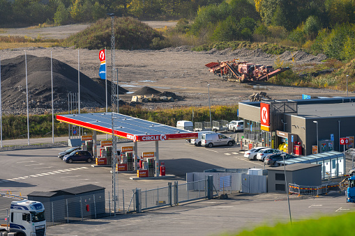 Gothenburg, Sweden - October 11 2022: Gas pumps and electric chargers at a Circle K energy station.
