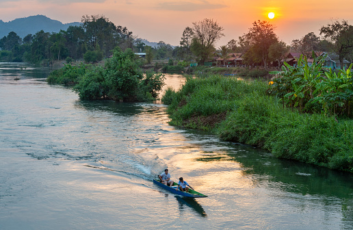 Don Det island,Champasak Province,southern Laos-February 2023:Beautiful,peaceful scene,viewed from the historic French colonial era bridge,linking Don Khon and Don Det islands,as dusk approaches.