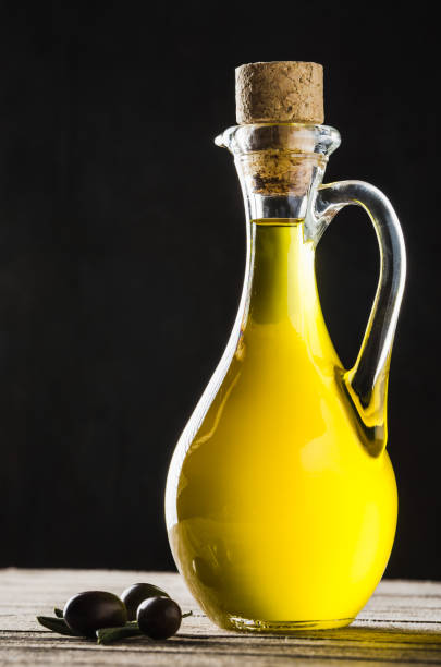 istock Olive oil and olive, extra virgin olive oil copy space background. 1763670277