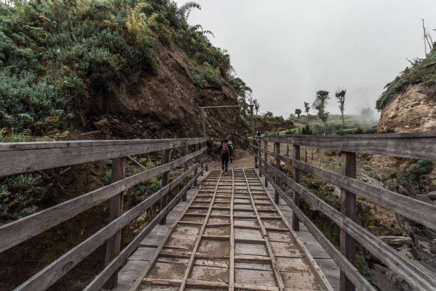 istock rocky volcanic landscape with a bridge with hikers on a cloudy afternoon 1763677063