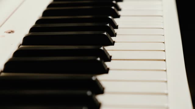 Piano keys close-up. Musical keyboard instrument. Selective focus.