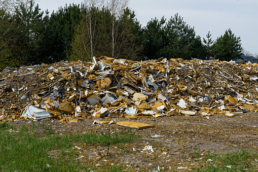 A pile of scrap iron, scrap, stainless steel, and rusted iron scrap from industrial metal waste