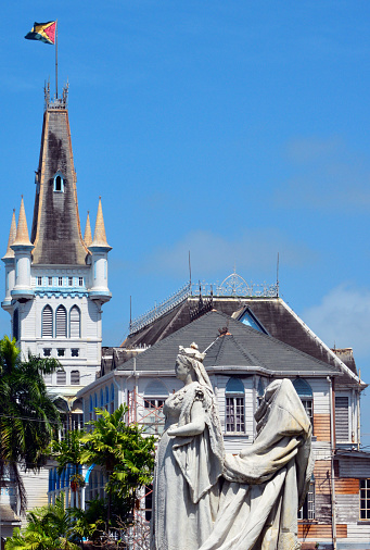 Georgetown, Guyana: Georgetown City Hall, completed in 1889, designed by architect Reverend Ignatius Scoles in Gothic-revival style and the nose-less statue of Queen Victoria, commissioned in 1887 to mark the Golden Jubilee, this statue was unveiled in 1894, sculptor Henry Richard Hope-Pinker, damaged by a bomb in 1954, in an anti-colonial protest - Avenue of the Republic - UNESCO world heritage tentative listing.