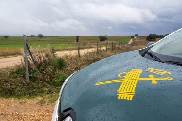 Spanish Civil Guard patrol car next to an agricultural road on a rainy day.. Badajoz, Spain. October 29, 2023. Spanish Civil Guard patrol car next to an agricultural road on a rainy day.. lluvia stock pictures, royalty-free photos & images