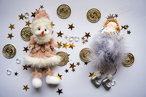 New Year Christmas tree toy, New Year decorations on a colored background. The Snowman and the Angel. High quality photo