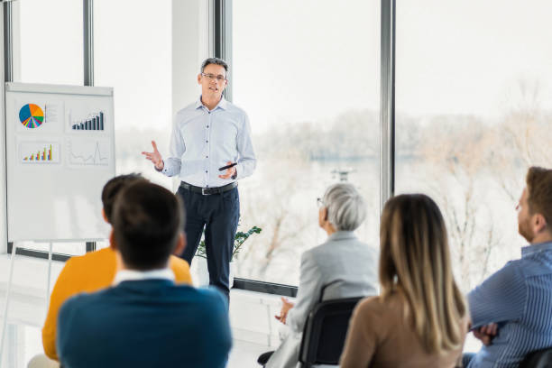 istock Business leader giving a speech on a seminar in board room. 1763769915