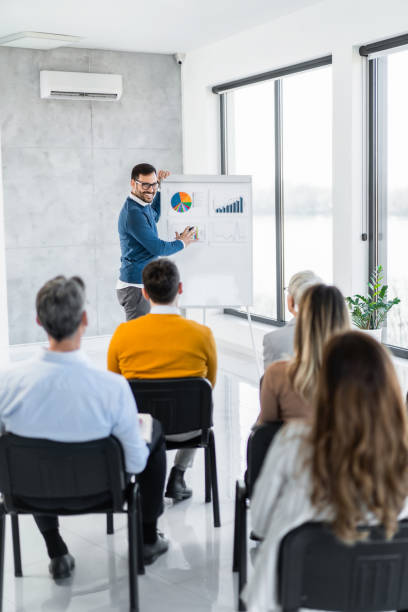 istock Business leader giving a speech on a seminar in board room. 1763778364