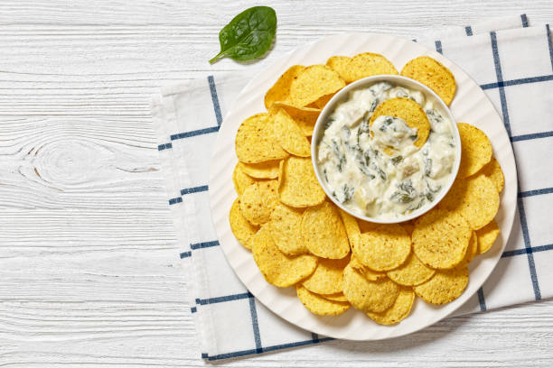 istock artichoke spinach almond dip with potato chips 1763784787