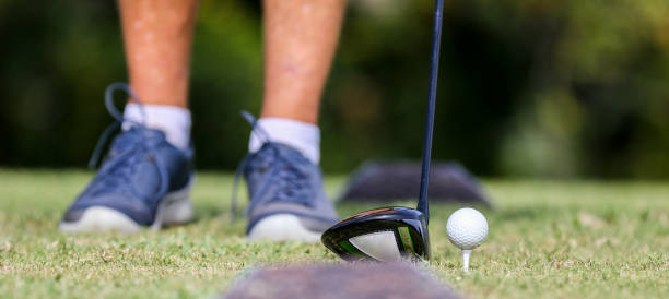 istock Lining up drive shot golf ball on tee on golf course in Central Florida 1763801673