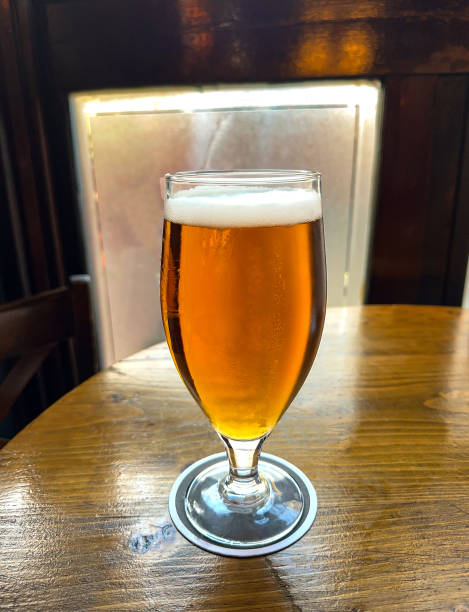 istock Glass of lager beer on a table in a British pub 1763811566