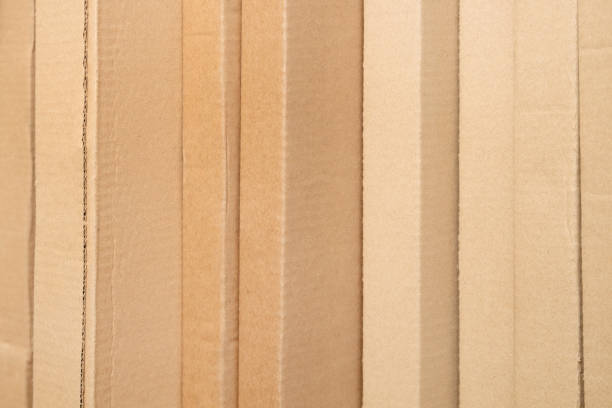 istock Many cardboard boxes stand tightly in a row, in a warehouse 1763828456