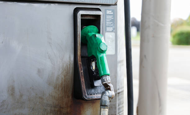 istock gas station scene with a rusted oil pump, under a setting sun, highlighting pricing, inflation, and rising fuel costs, evoking nostalgia and economic challenges 1763829568
