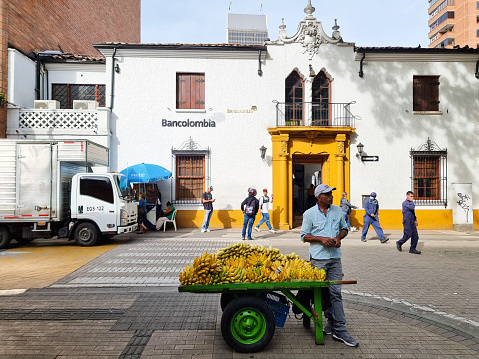 Colombia, Medellin, July 11, 2023, banana seller in Bolivar square