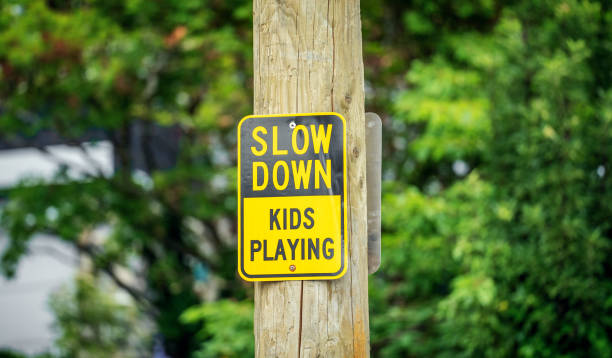 istock Slow down. Kids playing traffic sign 1763889112