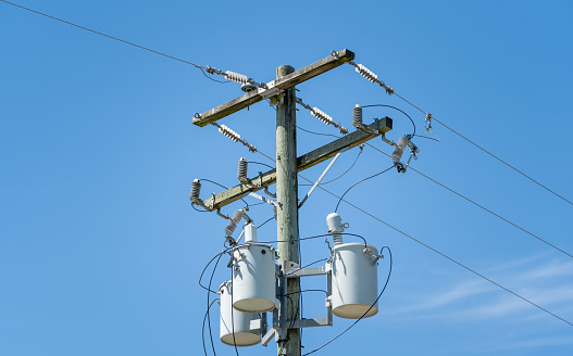 Electric pole with a three distribution transformers