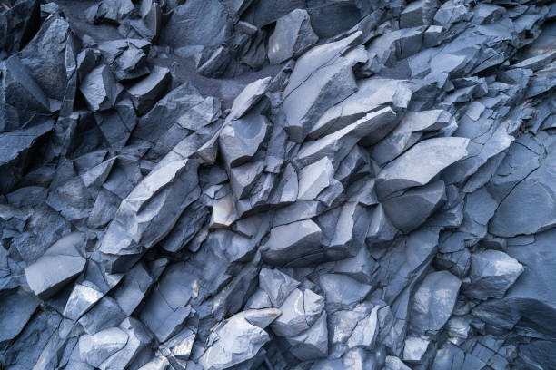 istock Basalt stones as a background. Image for background and wallpaper. Sharp rocks. Photography for design. Textures in nature. 1763919721