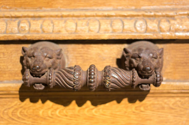  Ancient door knocker on a wood