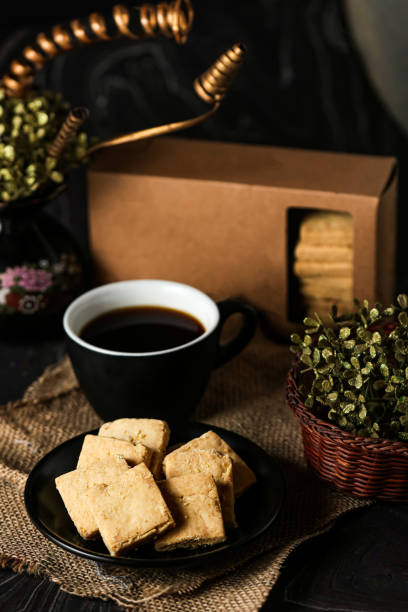 istock Crunchy cookies biscuits served in plate with black coffee isolated on table side view of american cafe baked food 1763940405