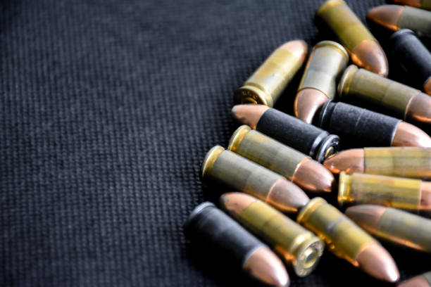 istock 9mm pistol gun and bullets 1763985849