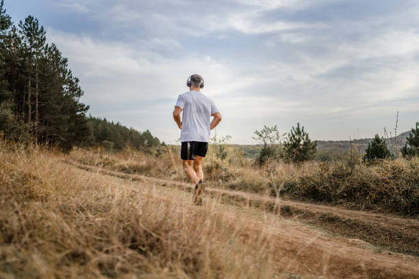 istock one man male athlete run in nature 1763994459